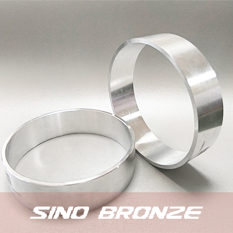 Original machined aluminum bushing on web
